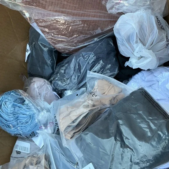 Quince Clothing Collection in Black, Blue, and Beige - Picture 3 of 4